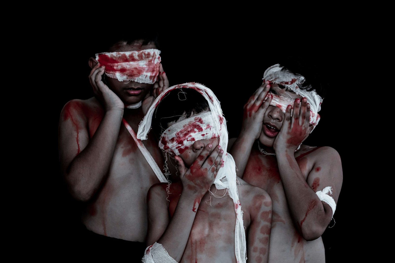 a couple of people that are covered in blood