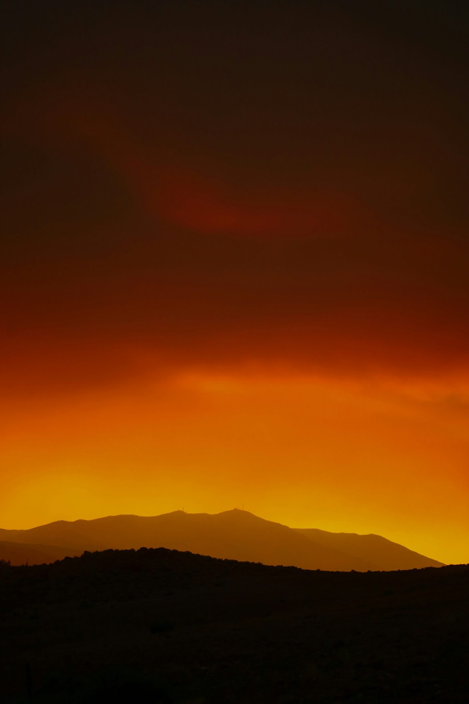 silhouette of mountain during sunset